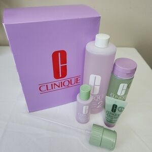 New 4 pc Clinique exfoliator and  soap set
